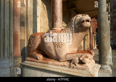 Romanesque Lion sculpture supporting columns of the Cremona Duomo Baptistry, begun 1107, Cremona, Lombardy, northern Italy Stock Photo