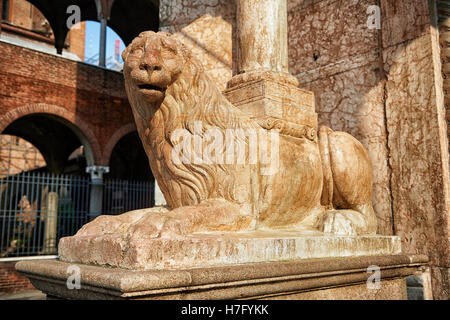 Romanesque Lion sculpture supporting columns of the Cremona Duomo Baptistry, begun 1107, Cremona, Lombardy, northern Italy Stock Photo