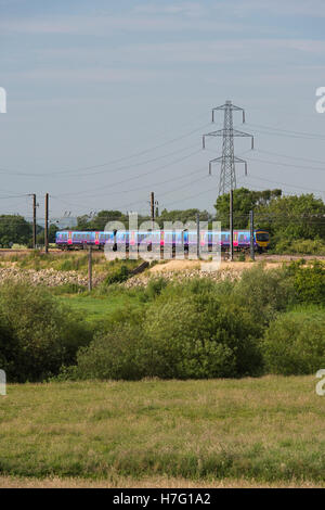 TransPennine Express, diesel multiple-unit train, travelling through countryside on the  East Coast Line near York, England. Stock Photo