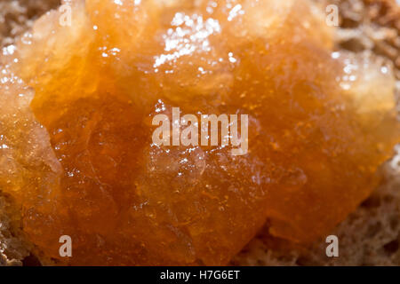 Apple jam with bubbles layered on toasted bread close up Stock Photo