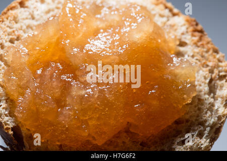 Apple jam with bubbles layered on toasted bread close up Stock Photo