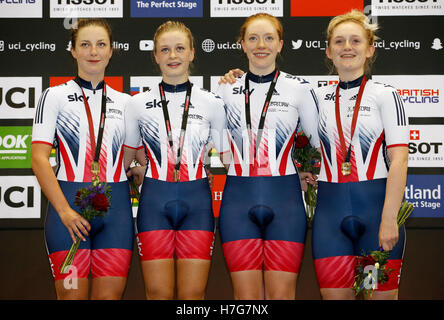 Great Britain's (from left to right) Manon Lloyd, Eleanor Dickinson, Emily Nelson and Emily Kay on the podium after winning gold in the Women's Team Pursuit during day one of the UCI Track Cycling World Cup at the Sir Chris Hoy Velodrome, Glasgow. Stock Photo