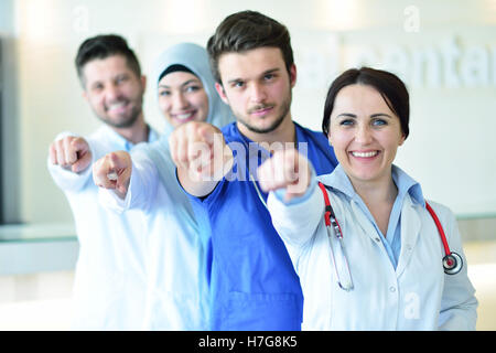 Portrait of doctors team showing thumbs up Stock Photo
