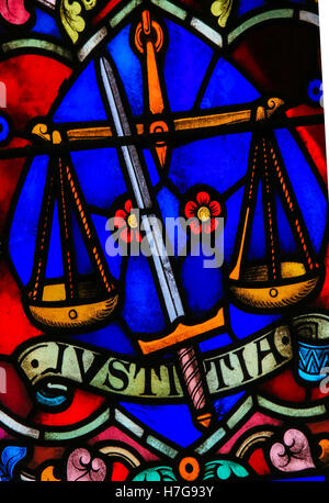 Stained Glass window representing Justice, symbolized by sword and balance, in the Cathedral of Saint Rumbold in Mechelen, Belgi Stock Photo