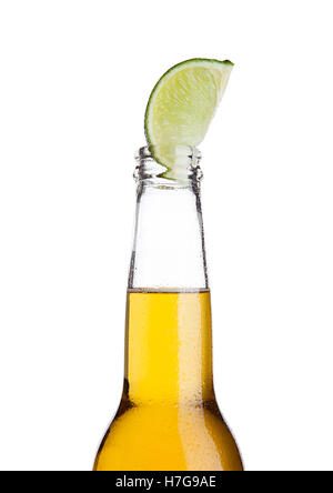 Mexican beer bottle with lime slice and frost on white background Stock Photo