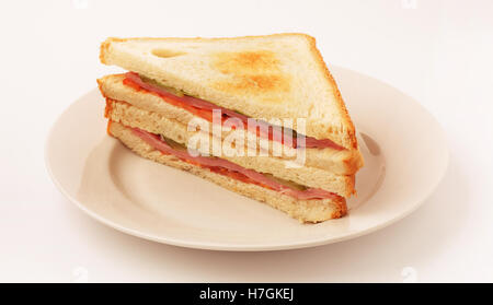 Sandwich with bacon and vegetables on white plate Stock Photo