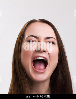 Emotion series of young and beautiful ukrainian girl - loud screaming Stock Photo