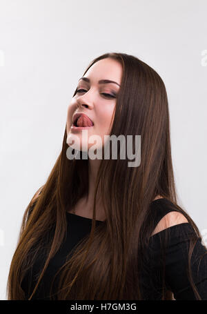 Emotion series of young and beautiful ukrainian girl - tongue licking lips Stock Photo