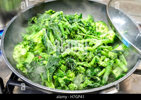 frozen broccoli turnip green cooking vegetable pan Stock Photo