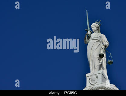 Goddess of Justice statue with scales and sword, at the top of Doge Palace in Venice (with copy space) Stock Photo