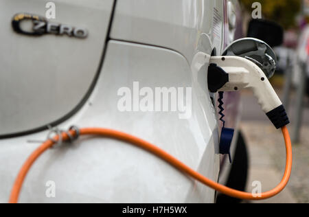 Berlin, Germany. 04th Nov, 2016. A charging plug can be seen attached to a Citroën C-Zero in Berlin, Germany, 04 November 2016. Photo: Sebastian Gollnow/dpa/Alamy Live News Stock Photo