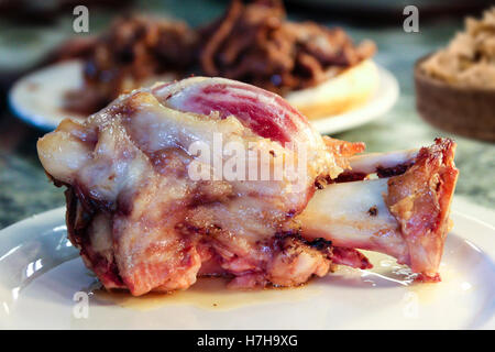 Traditional German ham hock dish with shallow depth of field on background. Stock Photo