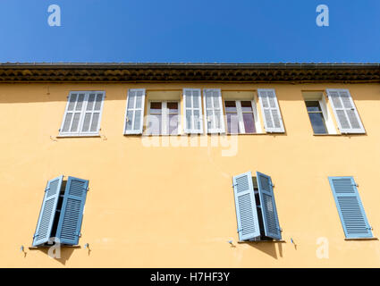 Shuttered windows on a building in Sainte Maxime, Var, France. Stock Photo