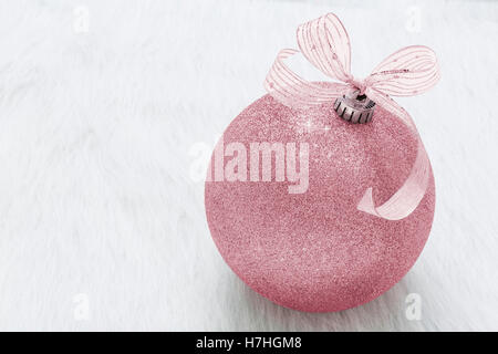 One beautiful, fancy,  perfect, sparkly, shiny, pink glitter Christmas ornament on horizontal white background Stock Photo