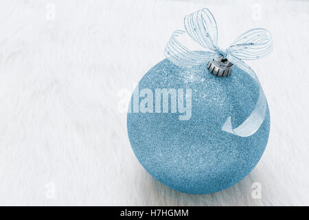 One beautiful, fancy,  perfect, sparkly, shiny, blue glitter Christmas ornament on horizontal white background Stock Photo