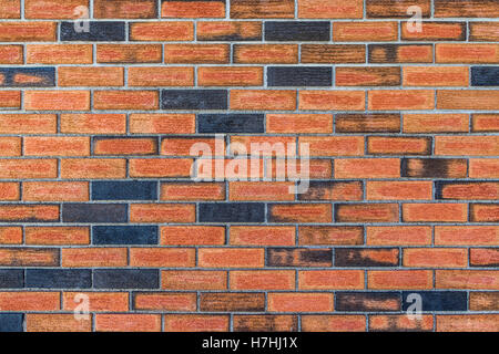 Seasoned red brick wall with rough texture background. Stock Photo