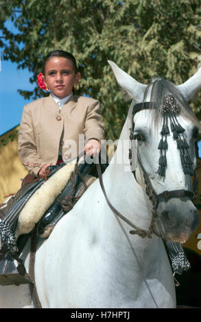 Boy on horseback during a Feria in Utrera, Andalusia, Spain, Europe Stock Photo