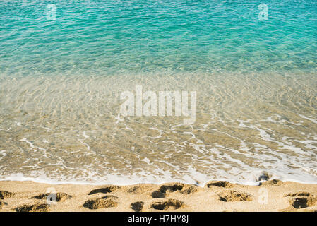 Clear water and footprints at Cleopatra beach, Alanya, Turkey Stock Photo