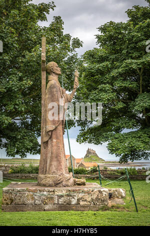 Statue of Saint Aidan. Lindisfarne Priory, Holy Island, Northumberland, England, UK Stock Photo