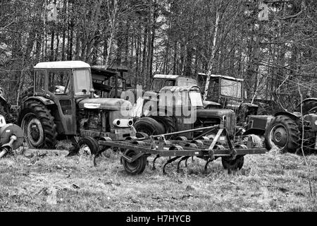 Old tractors on a scrap yard in Jutland, Denmark Stock Photo