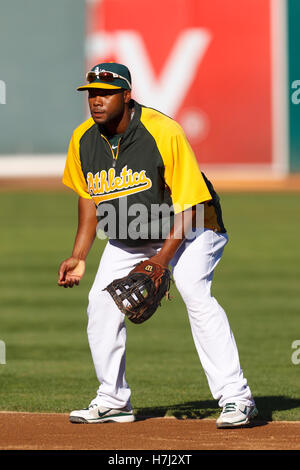 September 21, 2011; Oakland, CA, USA;  Oakland Athletics first baseman Brandon Allen (31) warms up before the game against the Texas Rangers at O.co Coliseum. Texas defeated Oakland 3-2. Stock Photo