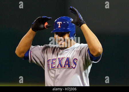 Seattle Mariners' Nelson Cruz is greeted in the dugout after he hit a  three-run home run in the first inning of a baseball game against the New  York Mets, Sunday, July 30