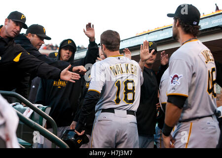 August 8, 2011; San Francisco, CA, USA;  Pittsburgh Pirates second baseman Neil Walker (18) is congratulated by teammates after scoring a run against the San Francisco Giants during the first inning at AT&T Park. Stock Photo