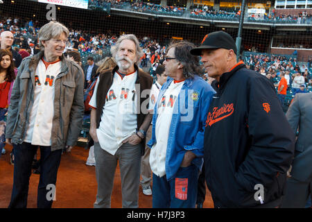 August 9, 2011; San Francisco, CA, USA;  Grateful Dead band members Phil Lesh (left), Bob Weir (second from left), Mickey Hart (second from right) talk with San Francisco Giants third base coach Tim Flannery (right) before the game against the Pittsburgh Stock Photo