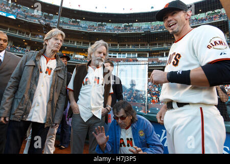 August 9, 2011; San Francisco, CA, USA;  Grateful Dead band members Phil Lesh (left), Bob Weir (second from left), Mickey Hart (second from right) talk with San Francisco Giants catcher Eli Whiteside (right) before the game against the Pittsburgh Pirates Stock Photo