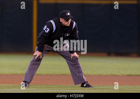 Umpire Phil Cuzzi, Mark Ripperger and Dan Bellino take the field