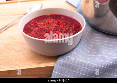 Bowl of homemade borscht on table. Stock Photo