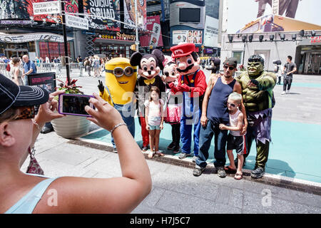 New York City,NY NYC Manhattan,Midtown,Broadway,Times Square,plaza,costume,characters,street performer,Hispanic ethnic adult,adults,man men male,boy b Stock Photo