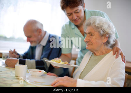 Old woman with nurse Stock Photo