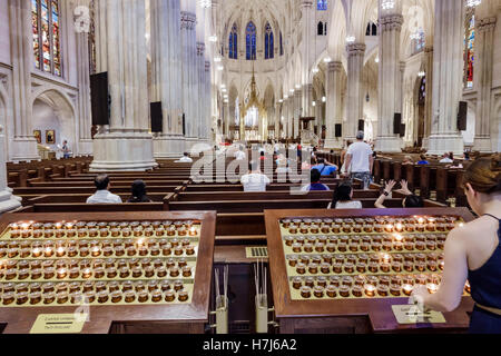 New York City,NY NYC Manhattan,Midtown,Fifth Avenue,St. Patrick's Cathedral,Catholic church,interior inside,Neo-Gothic,nave,votive candle,donation,adu Stock Photo