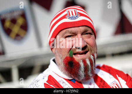 Stoke City fan Sean Ruane aka Hairy Potter with a poppy painted into his beard ahead of the Premier League match at London Stadium. Stock Photo