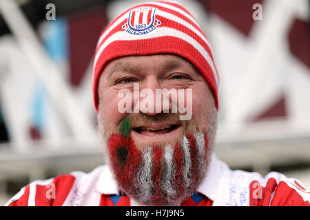 Stoke City fan Sean Ruane aka Hairy Potter with a poppy painted into his beard ahead of the Premier League match at London Stadium. Stock Photo