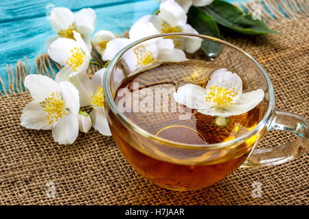 jasmine tea and jasmine flowers on  wooden background Stock Photo