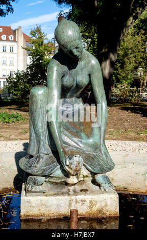 Fountain with young girl and turtle bronze sculpture 1963 by French sculptor Jean Henninger, Strasbourg, Alsace, France, Europe Stock Photo