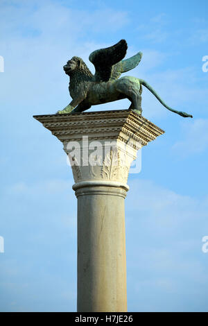 Lion of Saint Mark on a column at the St. Mark's Square of Venice in Italy. Stock Photo