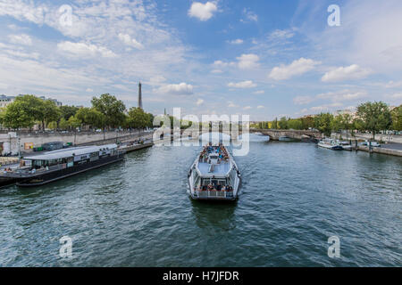 Tourist commercial boats going along the Seine river Paris France Stock Photo