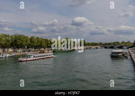 Tourist commercial boats going along the Seine river Paris France Stock Photo