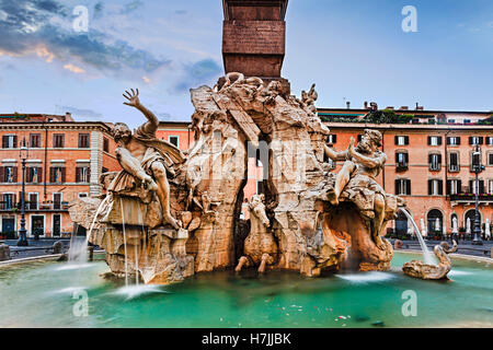 Navona square four rivers fountain in Rome, Italy, at sunrise. Historic architectural landmark with nobody around. Stock Photo