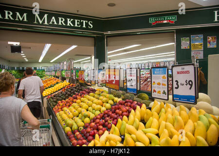 Harris Farm markets retail grocery store in North Sydney mangoes and other fruit in the aisle,Australia Stock Photo