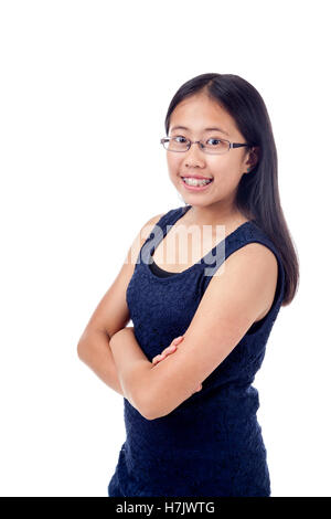 Cute Asian girl in braces striking a confident pose, isolated on white. Stock Photo