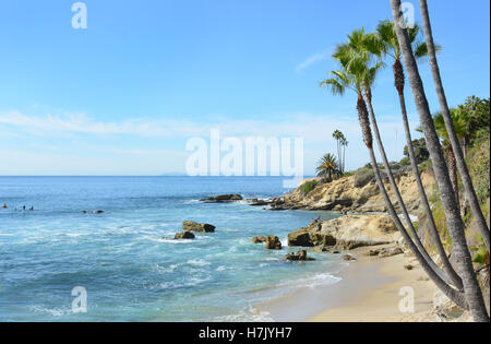 Cove in Laguna Beach, California. With Catalina Island in the distance. Heisler Parks Recreation Point on the bluff and surfers Stock Photo