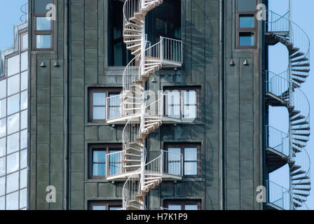 Emergency fire escape staircases on a building exterior. Urban architecture in Hamburg, Germany Stock Photo