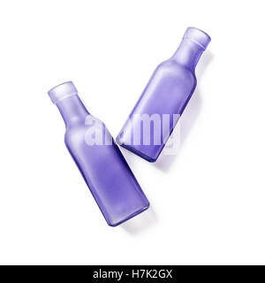 Two lilac glass empty bottles. Handmade vases. Group of objects isolated on white background clipping path included. Top view Stock Photo