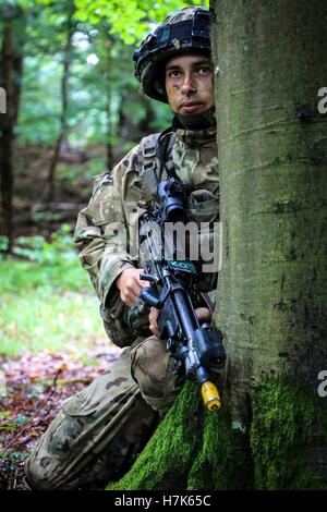 A British soldier provides security during an Allied Spirit II field training exercise at the U.S. Army Joint Multinational Readiness Center August 16, 2015 in Hohenfels, Germany. Stock Photo
