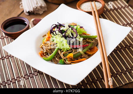 Soba noodles with beef, carrots, onions and sweet peppers. Stock Photo