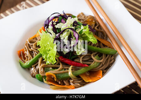 Soba noodles with beef, carrots, onions and sweet peppers Stock Photo